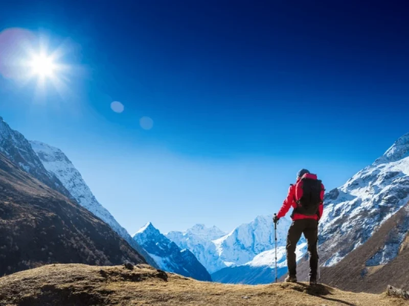 active hiker hiking enjoying view while trekking in nepal