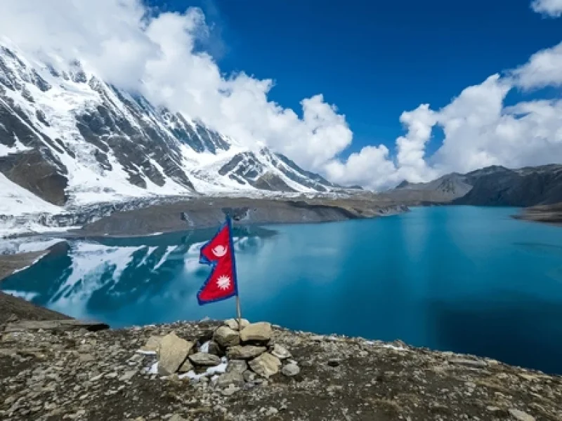 nepal national flag fluttering in trekking destionation in nepal